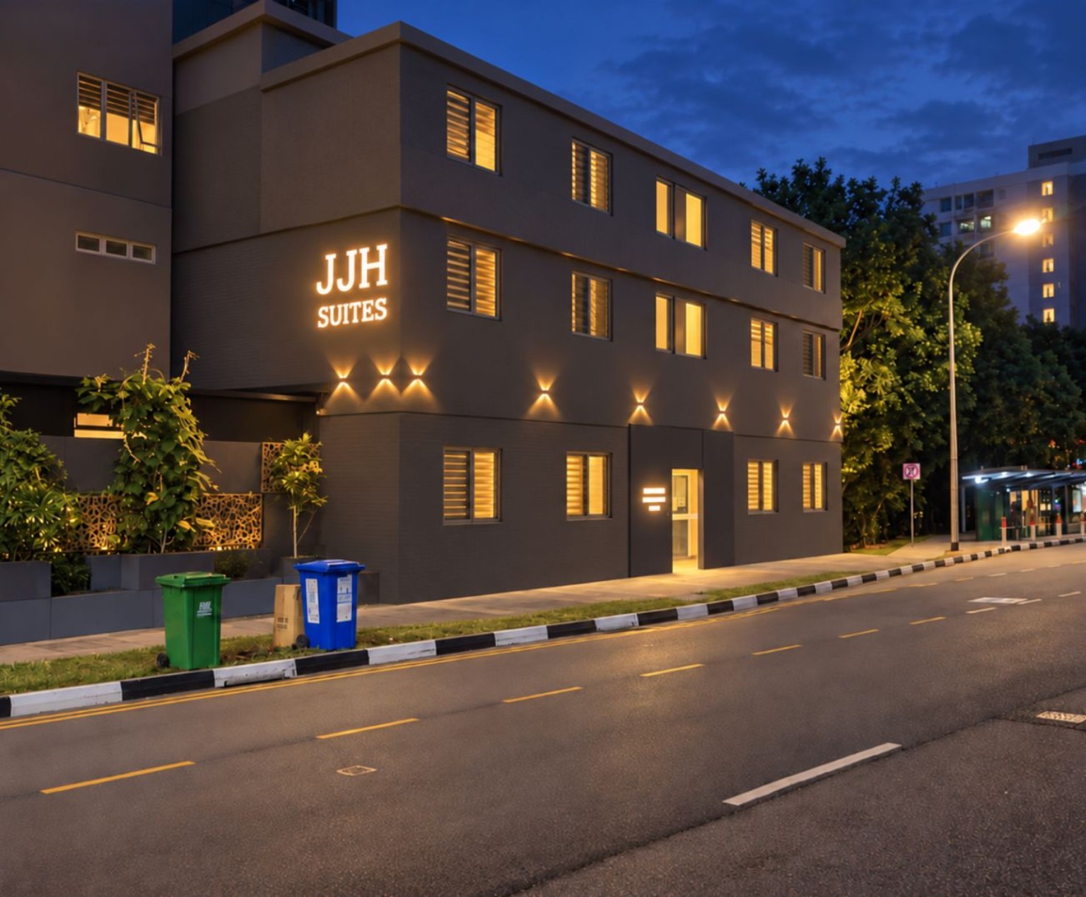 JJH Suites serviced apartment building illuminated at blue hour